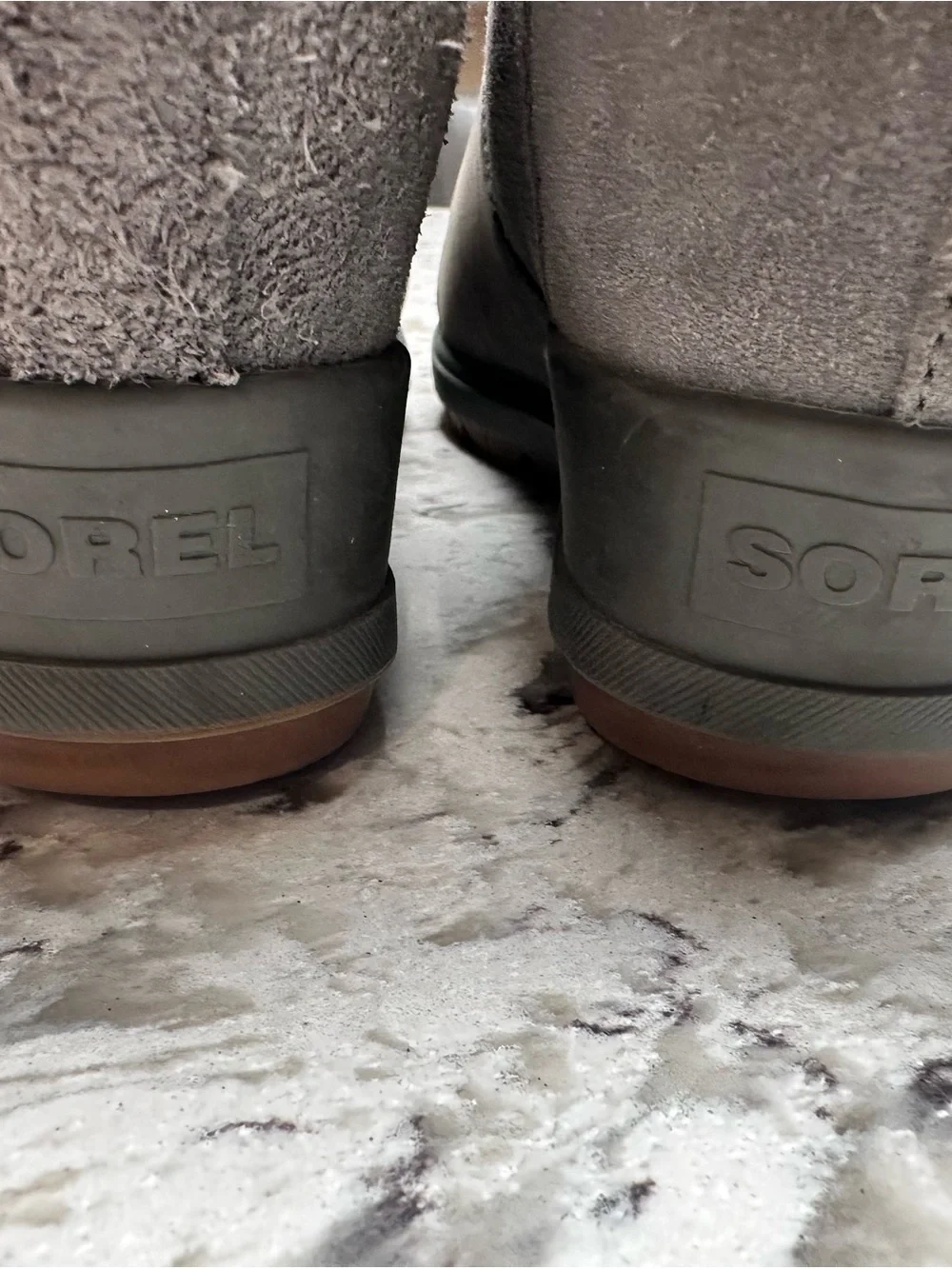 Sorel Evie II Chelsea waterproof boots in a gray leather and suede finish.
